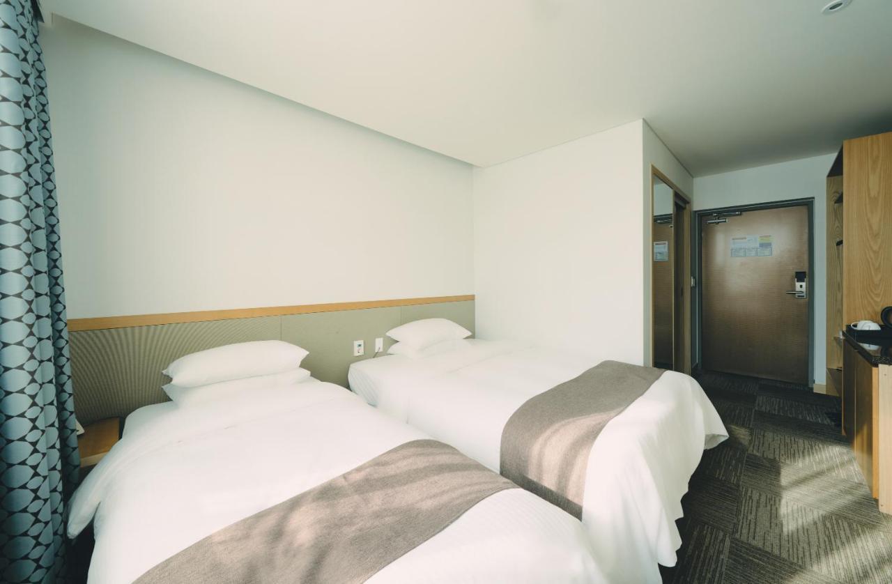 Jeju Poong Gyung Hotel Seogwipo Bagian luar foto