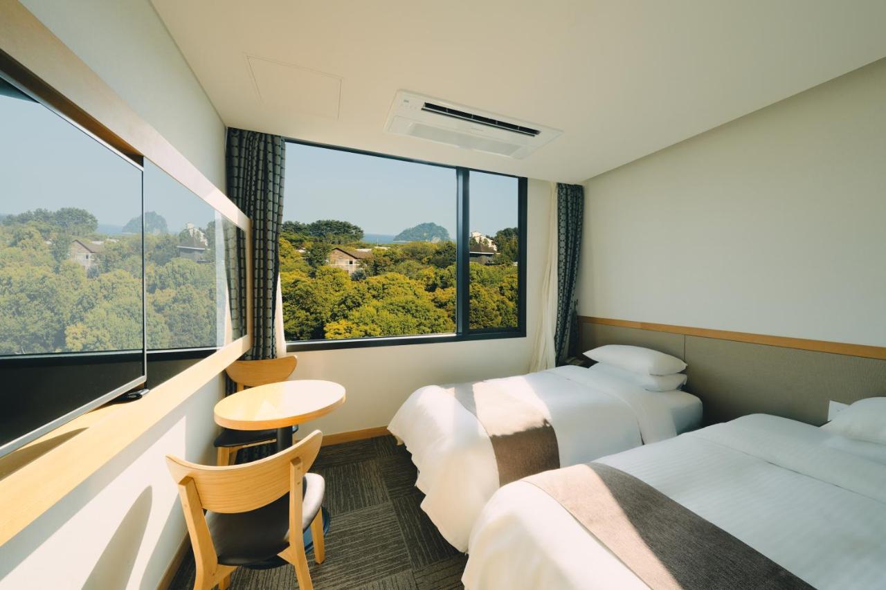 Jeju Poong Gyung Hotel Seogwipo Bagian luar foto